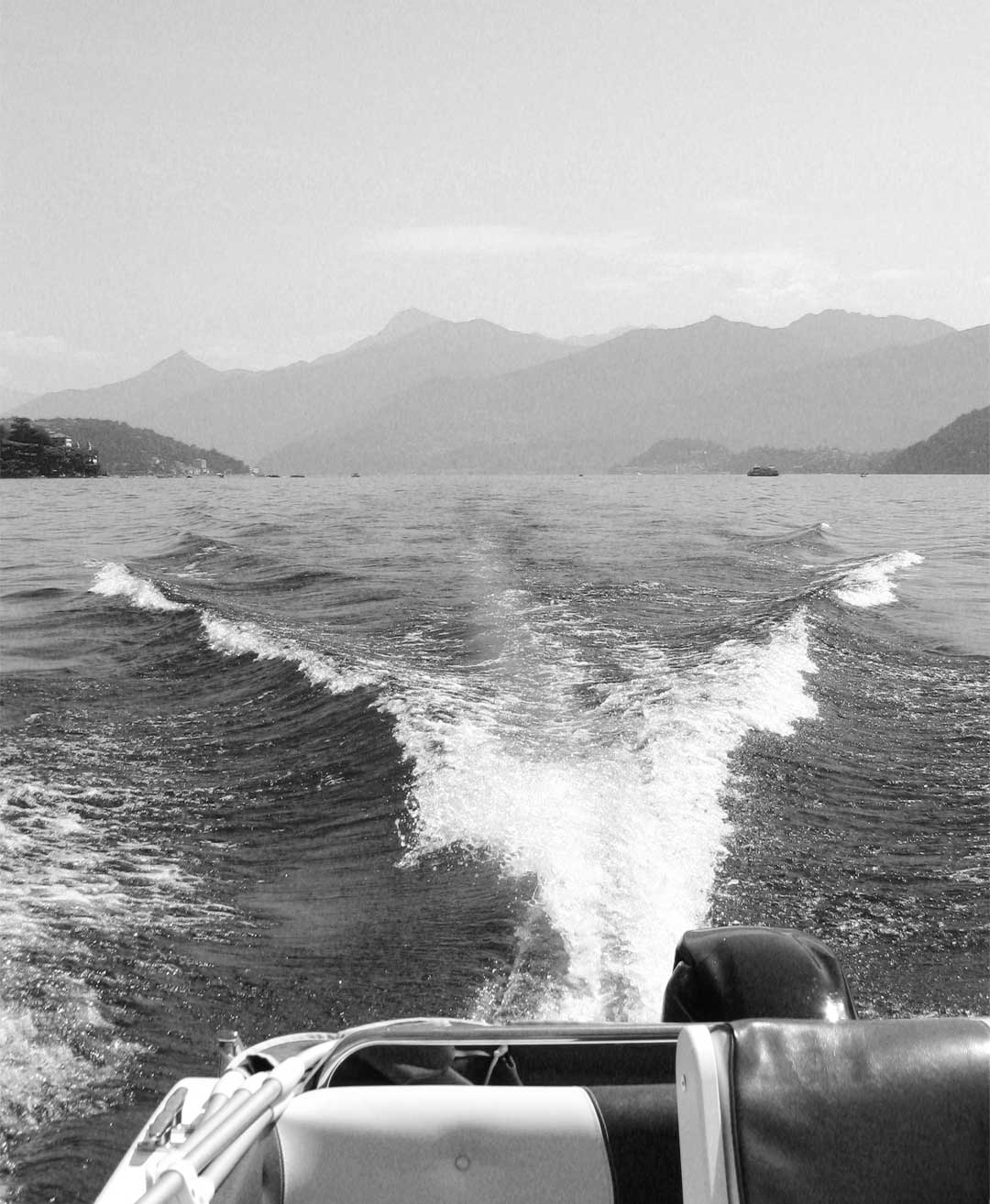 Wake left by a 40 HP self-drive boat cruising across Lake Como.