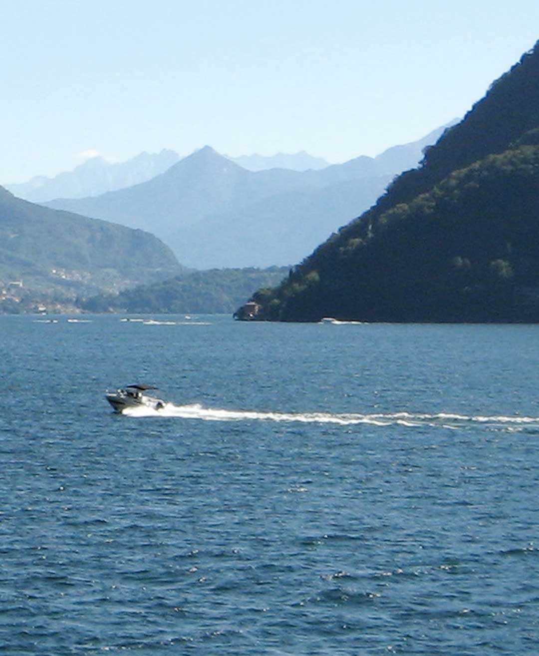 Self-drive rental boat cruising across Lake Como.