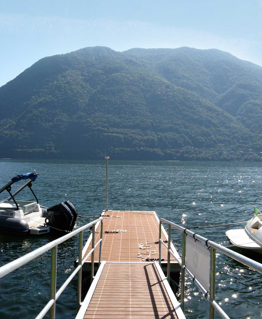Private Telos Boats dock offering safe and relaxed boarding away from Lake Como's busy public marinas.