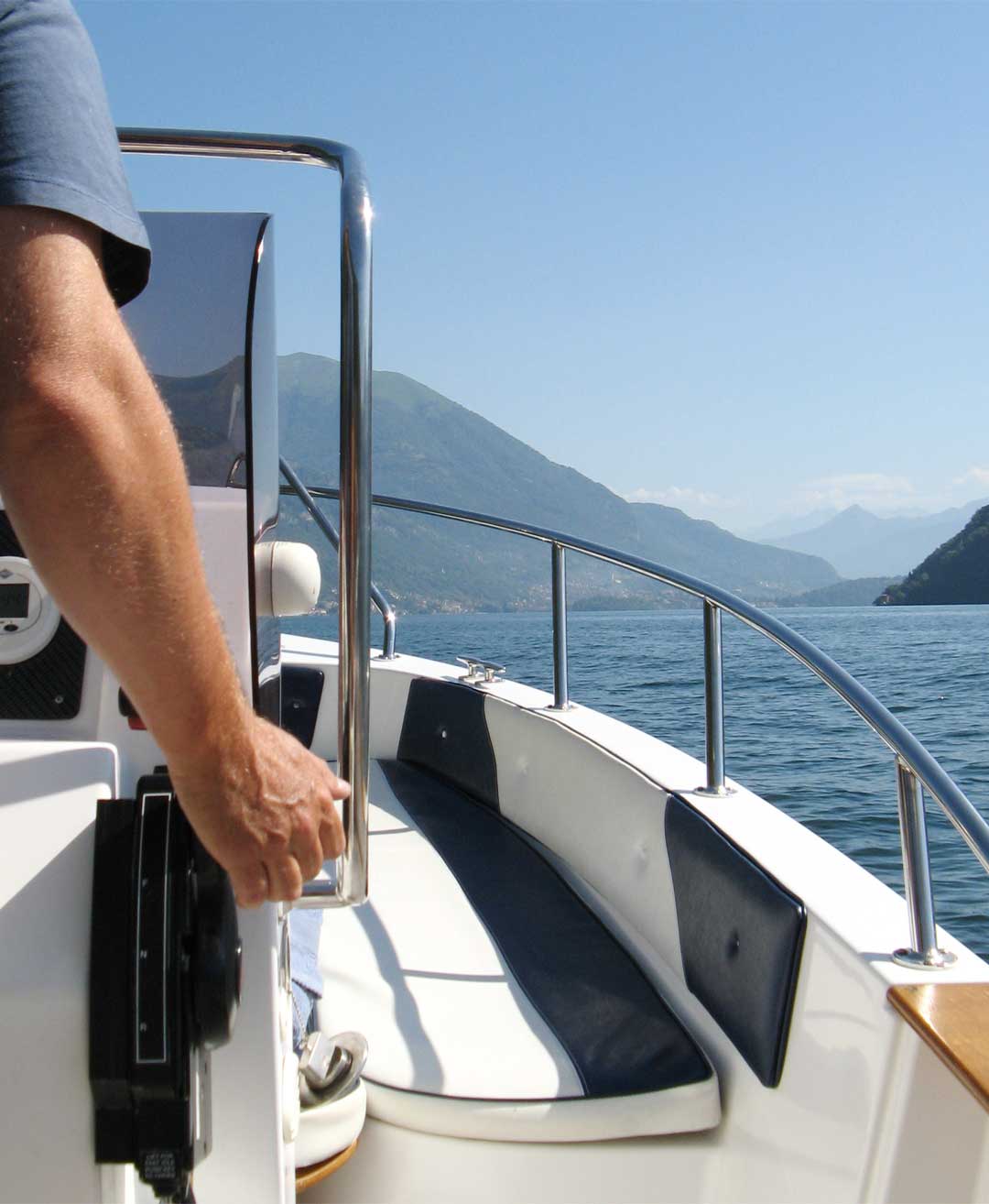 40 HP self-drive boat cruising on Lake Como, offering the freedom to explore with no boating licence required.